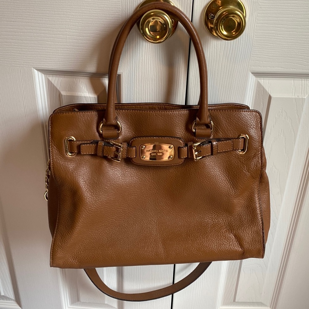 MK brown purse! It has so many pockets inside to keep all your items organized!